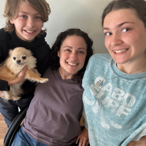 Photo of Carli H. with her son and daughter