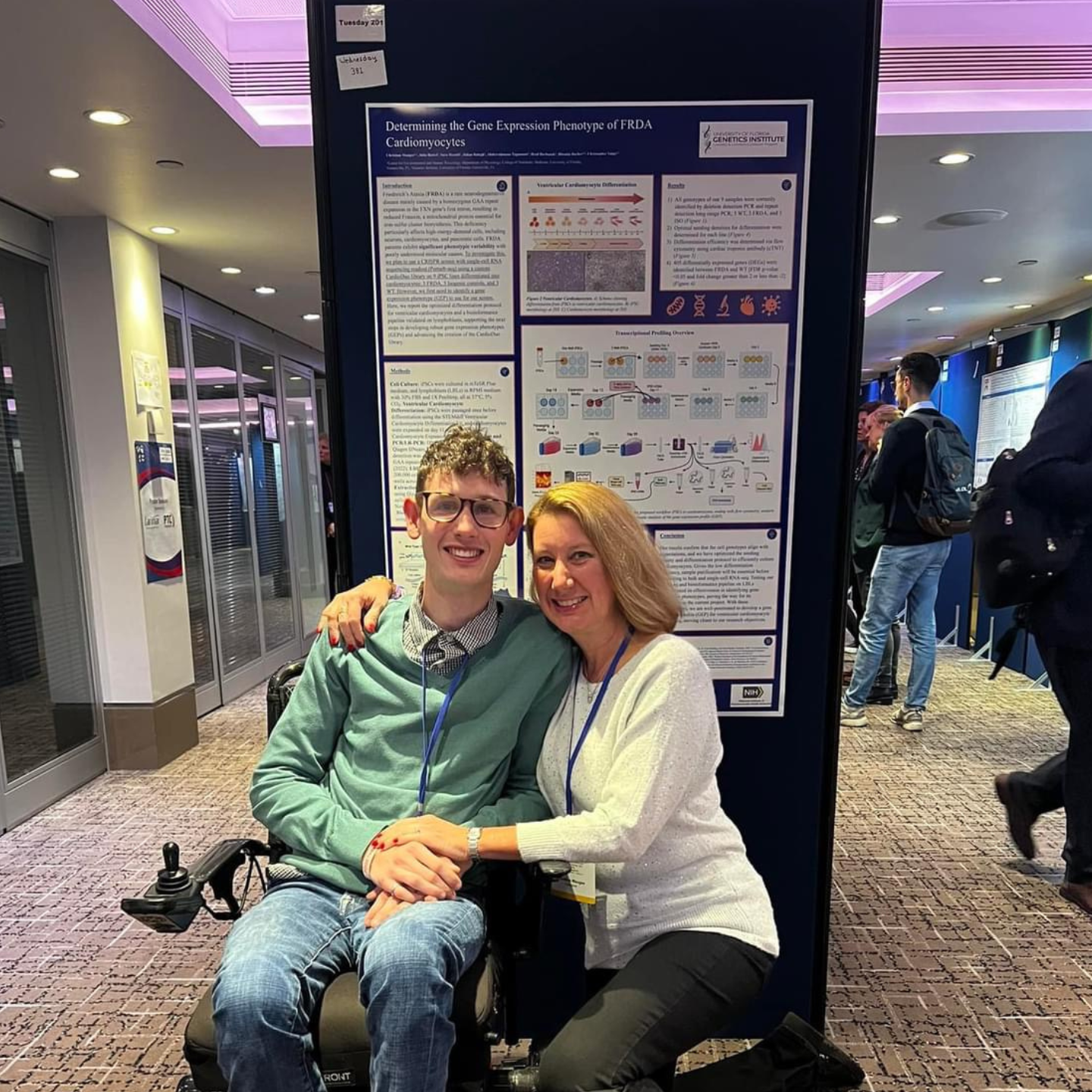Photo of Christian Maugee in front of his research poster at ICAR 2024