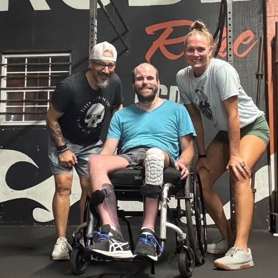 Picture of Preston with his gym coaches